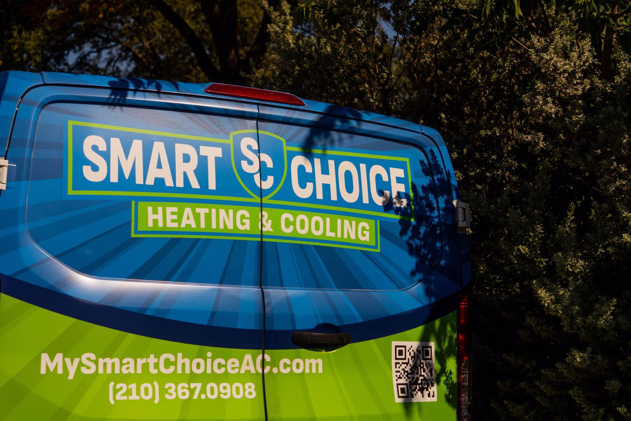 Close up of the Smart Choice Heating and Cooling van wrap showing the company phone number